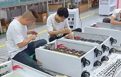 A factory technician managing customized private label silk-screen logo printing and bespoke packaging for the high-capacity mobile LiFePO4 battery pack, highlighting Haven Deer’s comprehensive OEM and ODM processing capabilities based on customer drawings and samples.