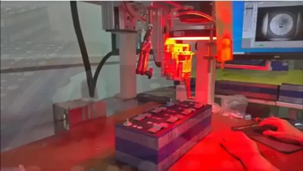 Industrial 3000W laser welding equipment connecting battery terminals on premium LiFePO4 modules.